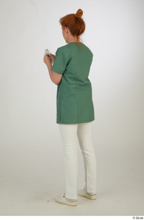 Photos Daya Jones Nurse in green Pose 2 preparing medication…